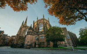 Historic building surrounded by autumn trees - representing broadband in Coventry